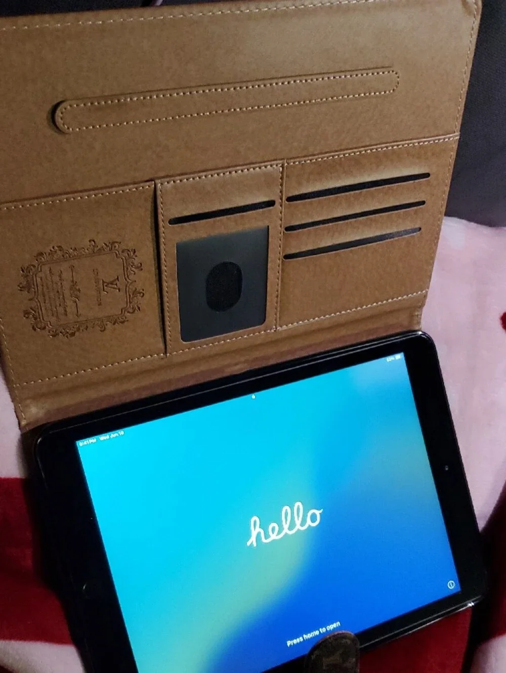 Black Tablet with Blue Screen Apple Ipad Info In The Pictures